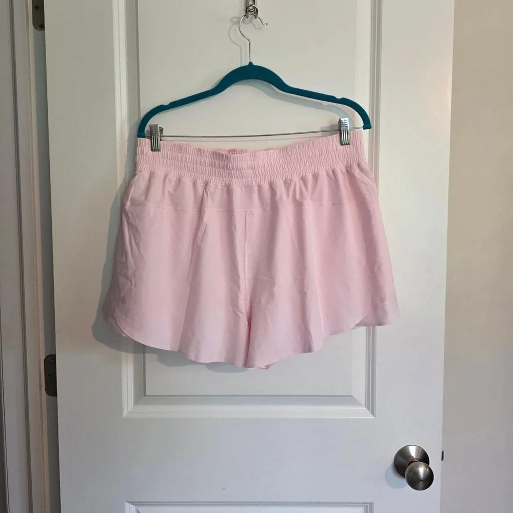 Lululemon Shake It Out High Rise Run Shorts in light baby pink pearl color